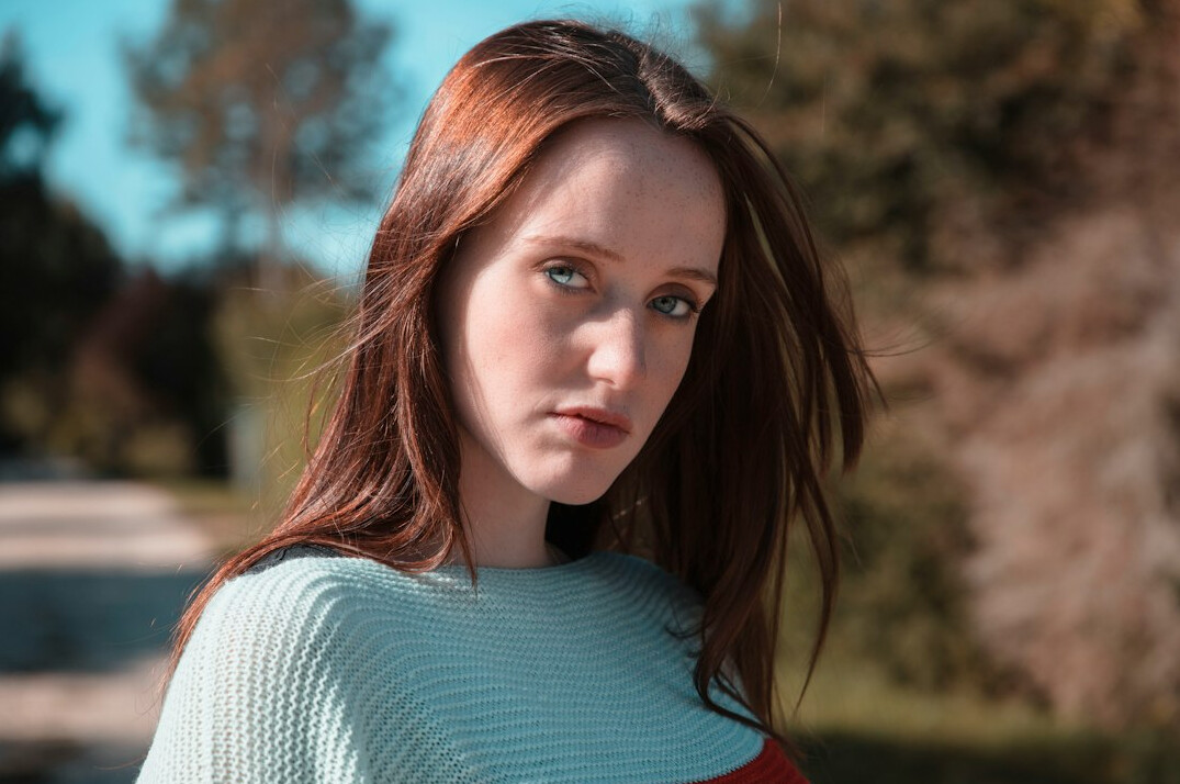 Portrait of a woman documentalist with straight auburn hair