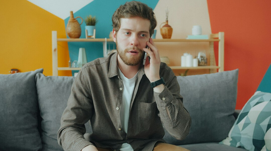 Portrait of a young man science communicator with a beard