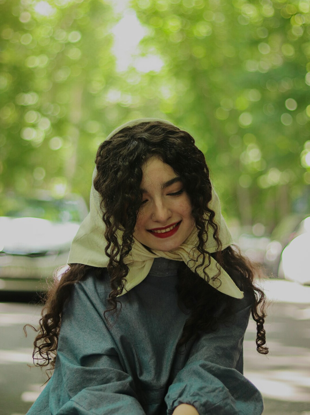 Portrait of a woman historian with curly brown hair