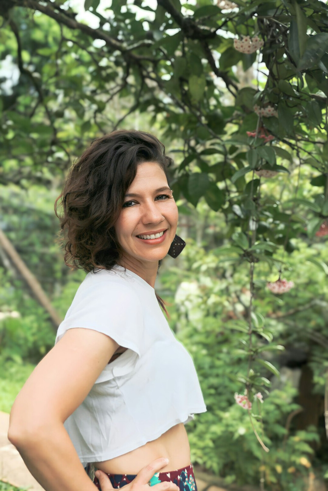 Portrait of a smiling woman editor in her forties with dark hair