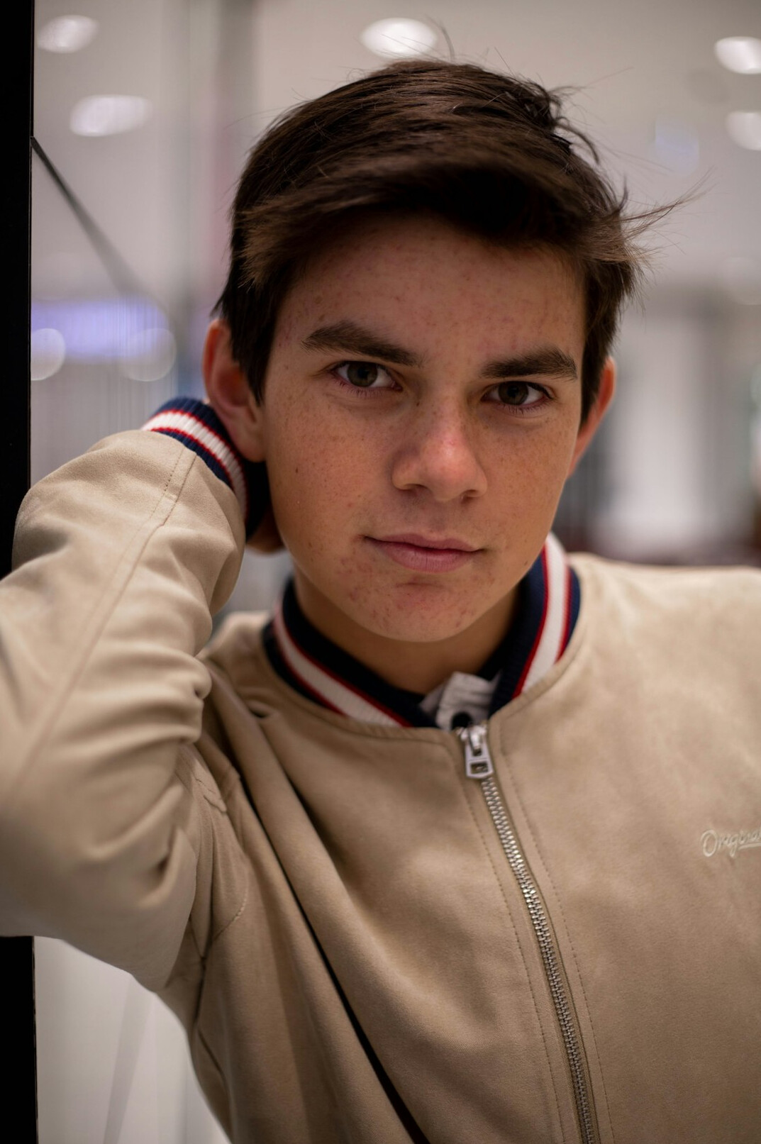 Portrait of a young man with short dark hair and a casual jacket