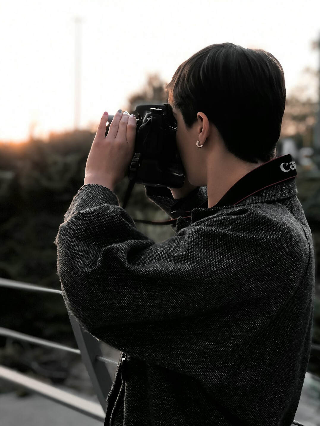 Portrait of a woman photographer with short black hair