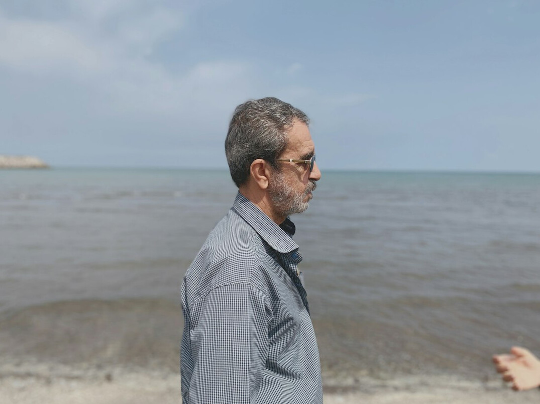Portrait of a man archivist with grey hair and glasses